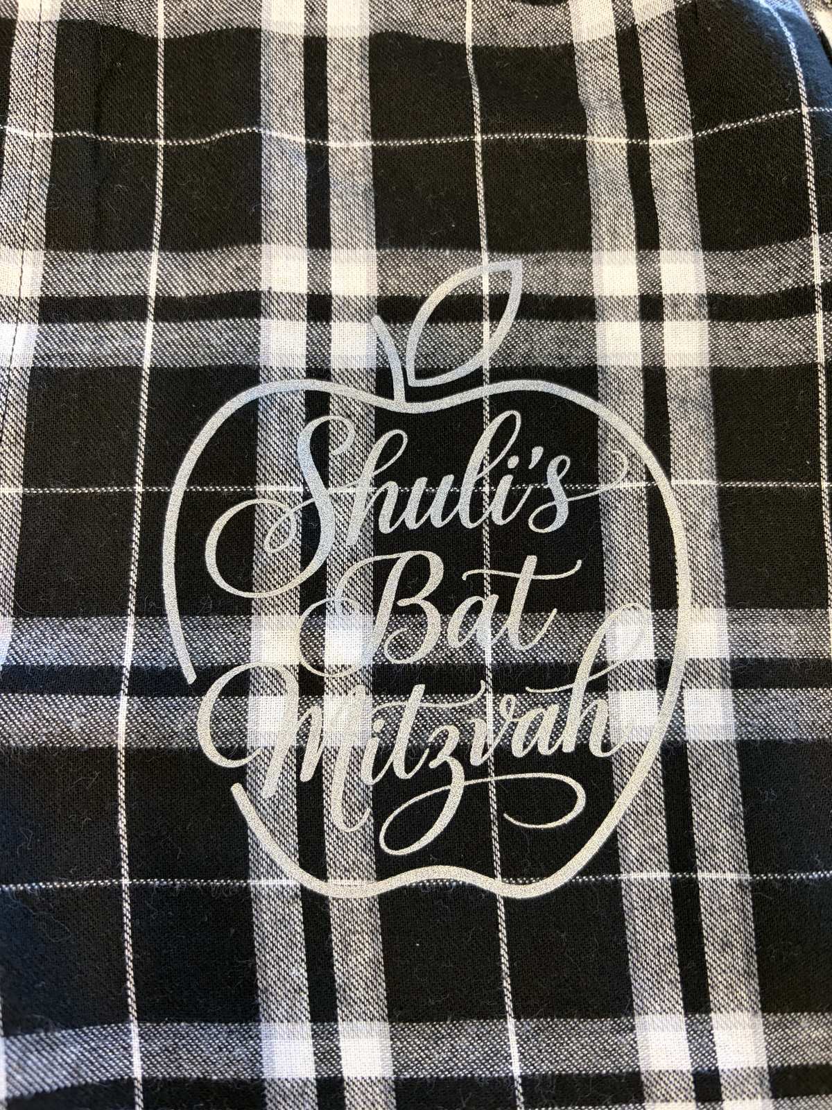 Black plaid custom pajama pants printed with a bat mitzvah design
