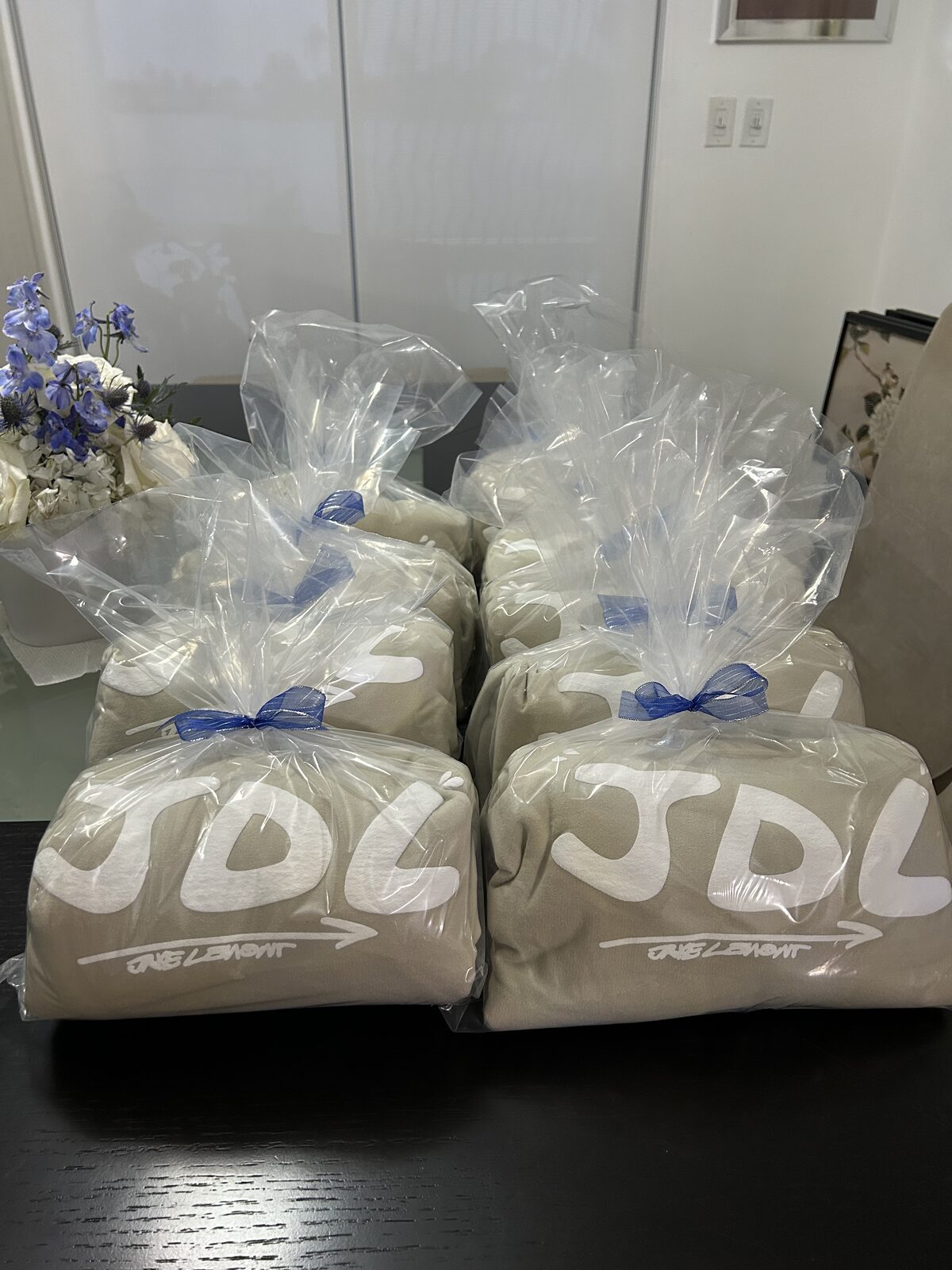 Custom printed fleece blankets packaged as event gifts