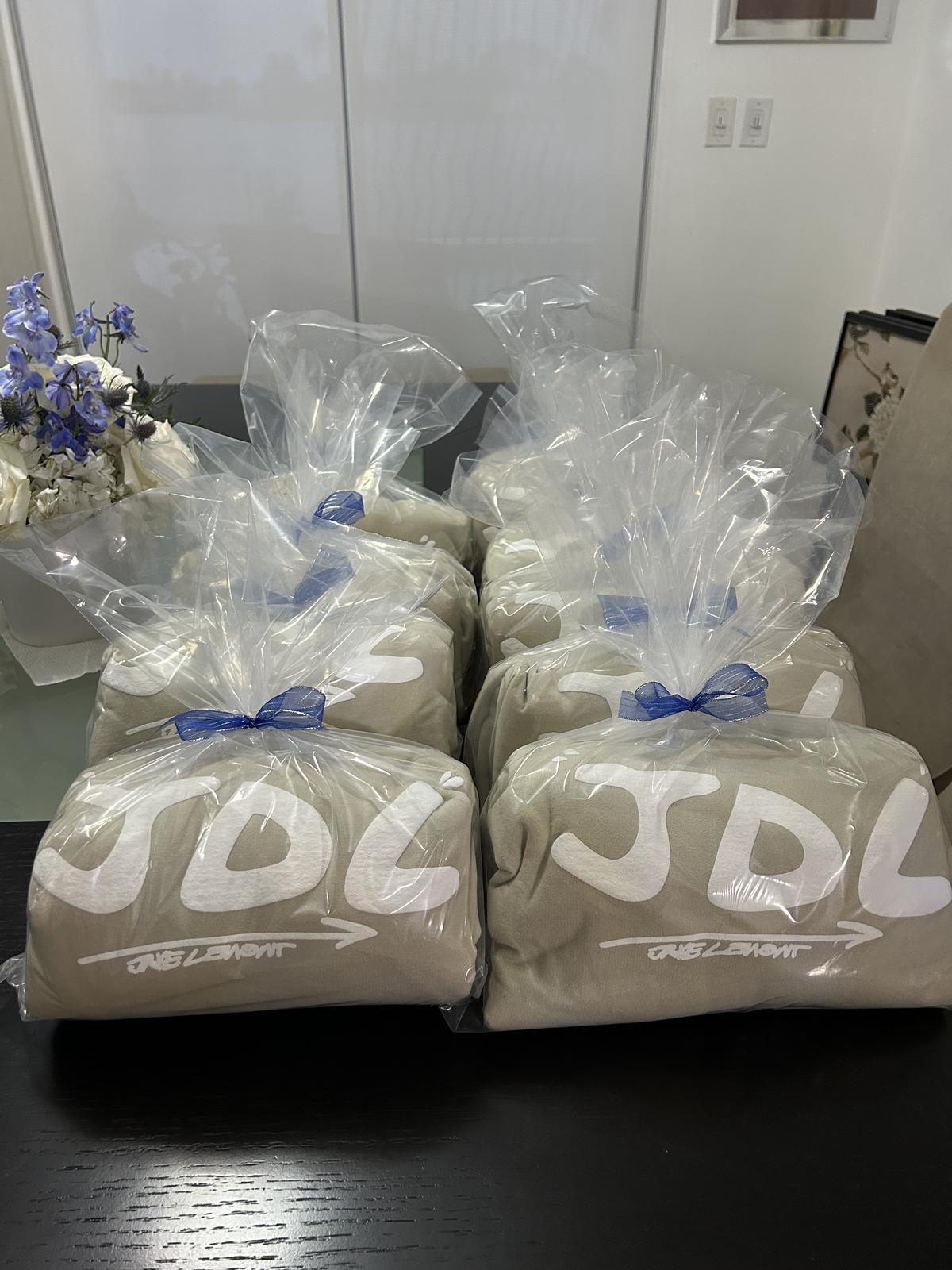 Custom printed fleece blankets packaged as event gifts