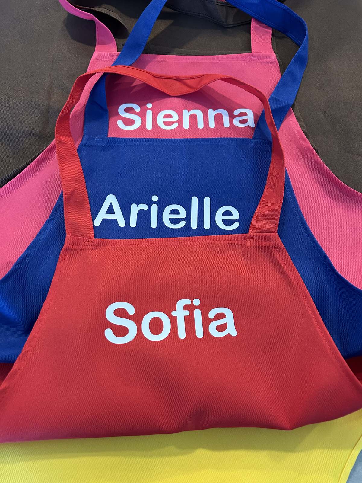 Personalized children's aprons printed with names