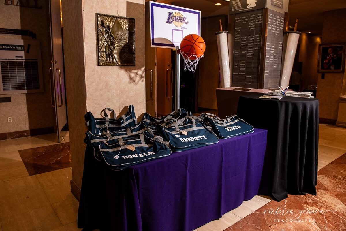 Display table of custom branded bags and promotional products at an event