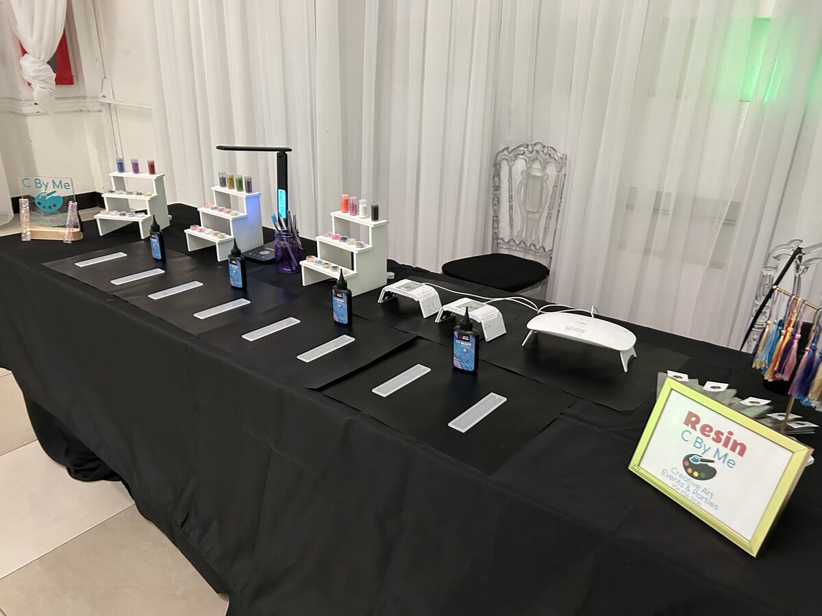 Elegant resin station set up with white drapery at a formal event