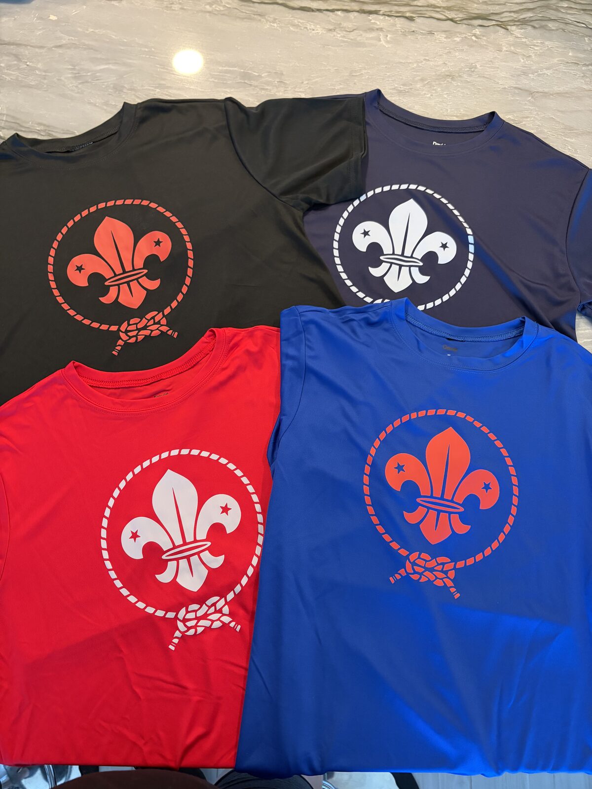 Custom screen printed scout shirts in four colors