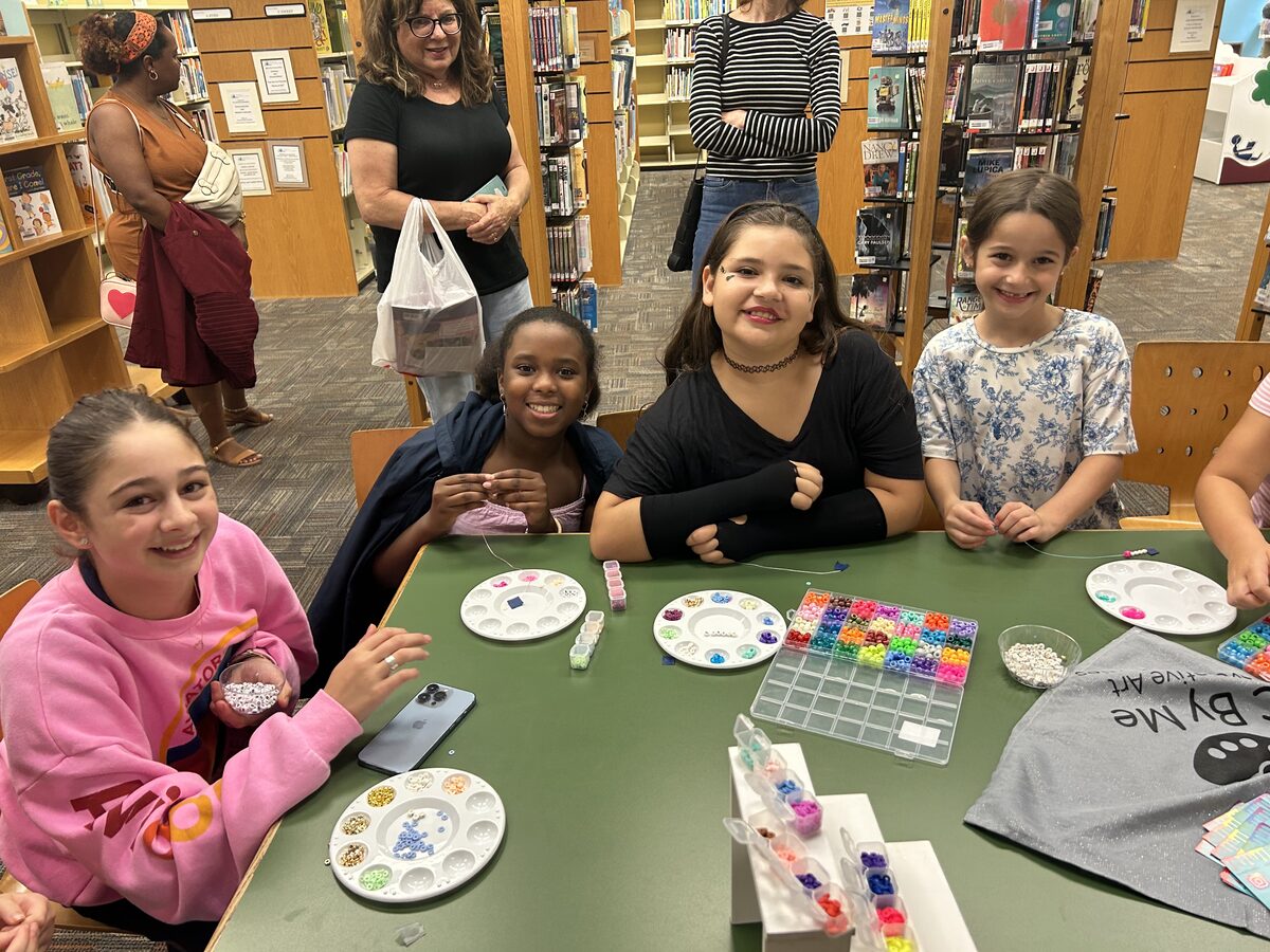 Children at a C By Me craft program in a public library